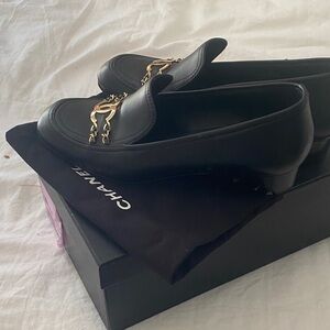 CHANEL Black Flats with Gold Chain Accent
